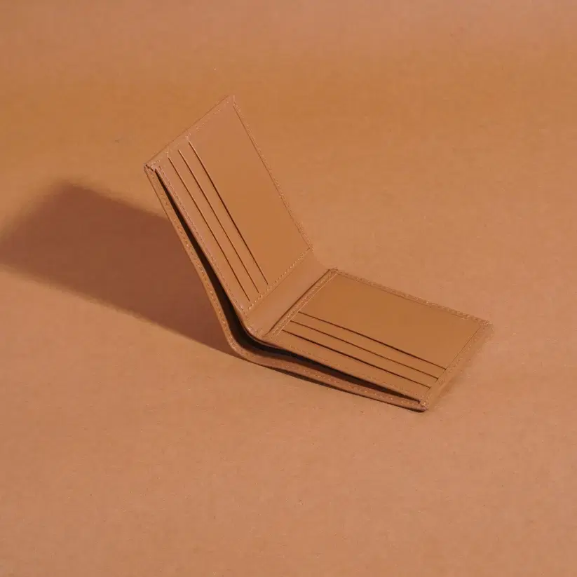 Mini Leather Wallet —  Tan leather product — leather product photo 1